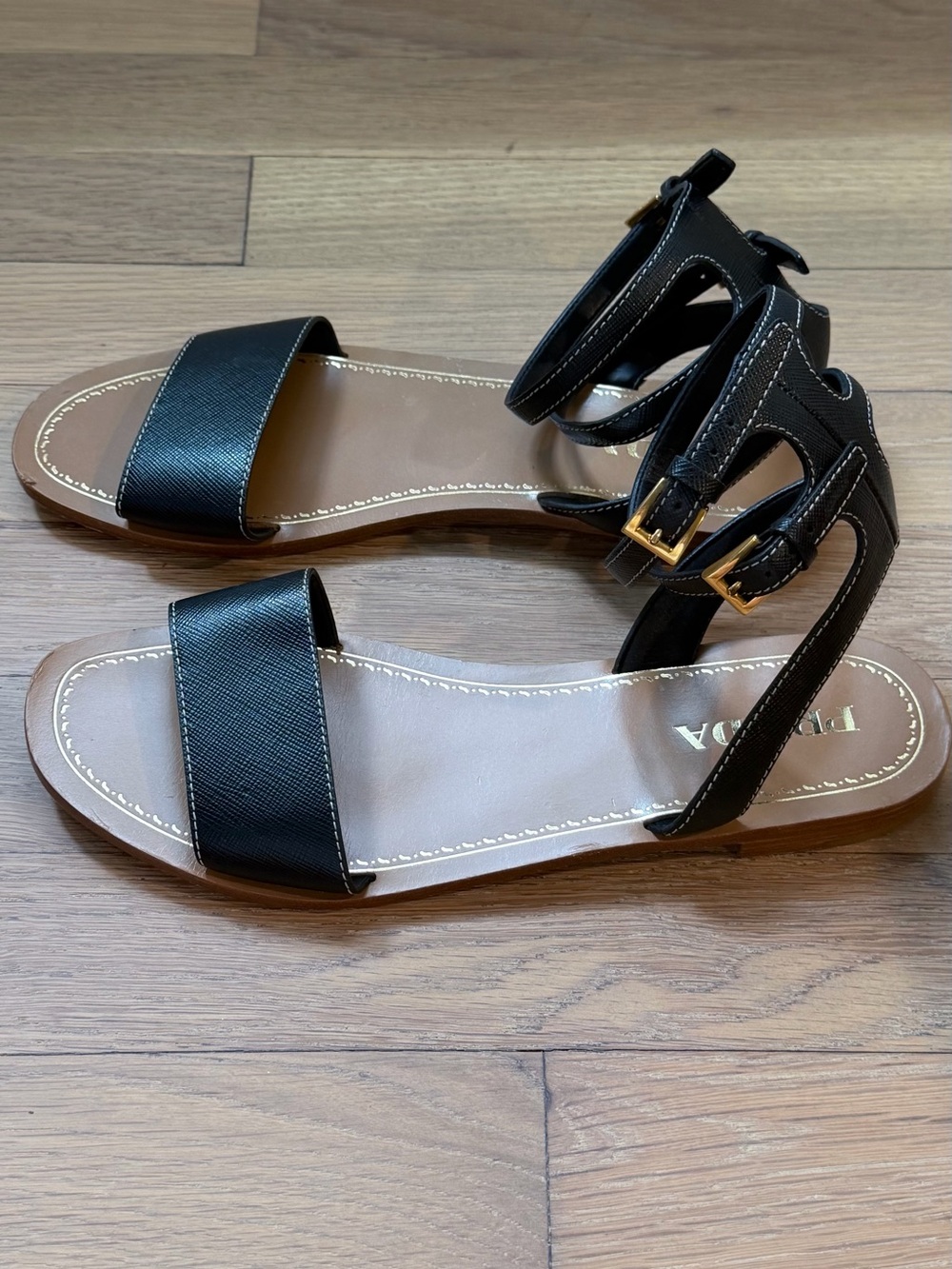 Prada Black Leather Ankle-Strap Flat Sandals with Gold Buckles